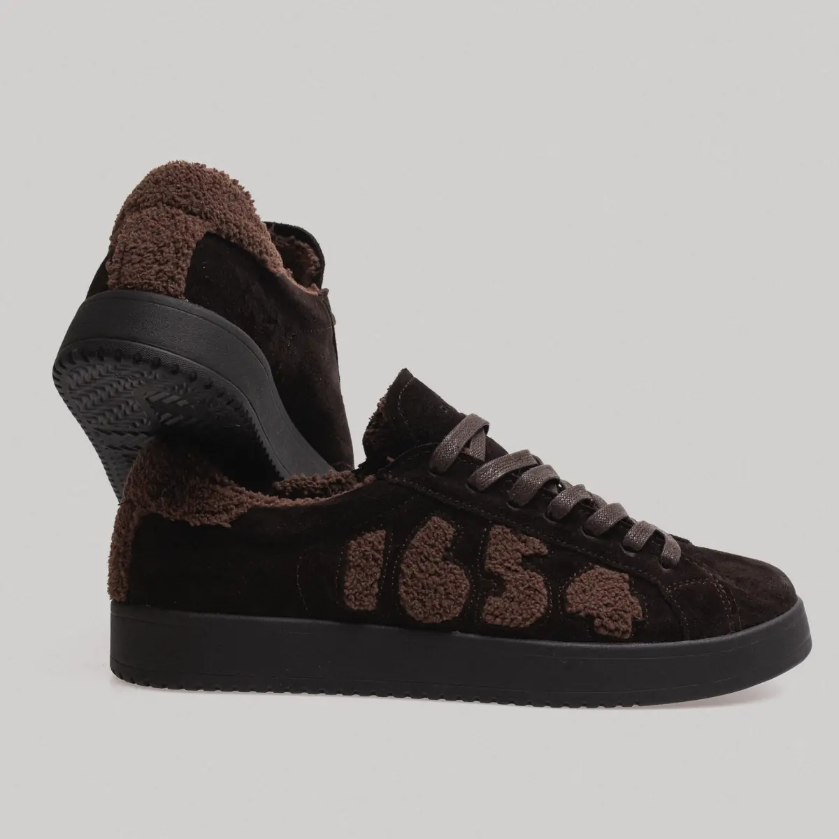 Dark brown men's nubuck sneakers 1654-24 with a faux-fur collar, the upper shoe tilted to show the sole tread