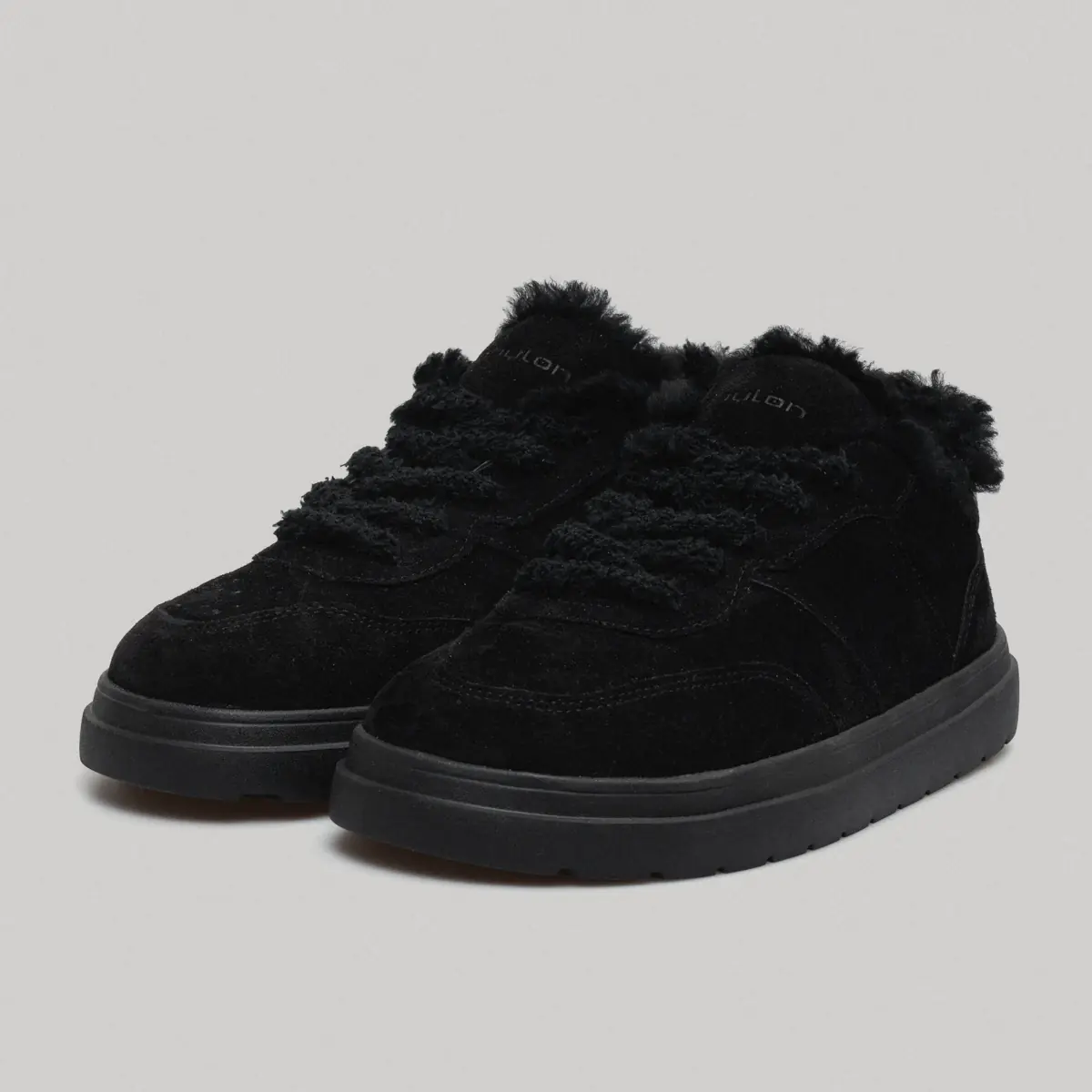 Black women's low-top nubuck sneakers Mellow-11 with black natural fur around the collar on a white background