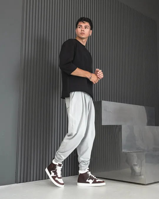 Babylon high-top sneakers with light joggers in a modern interior