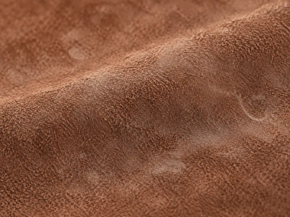 Suede before cleaning: water marks and matted nap