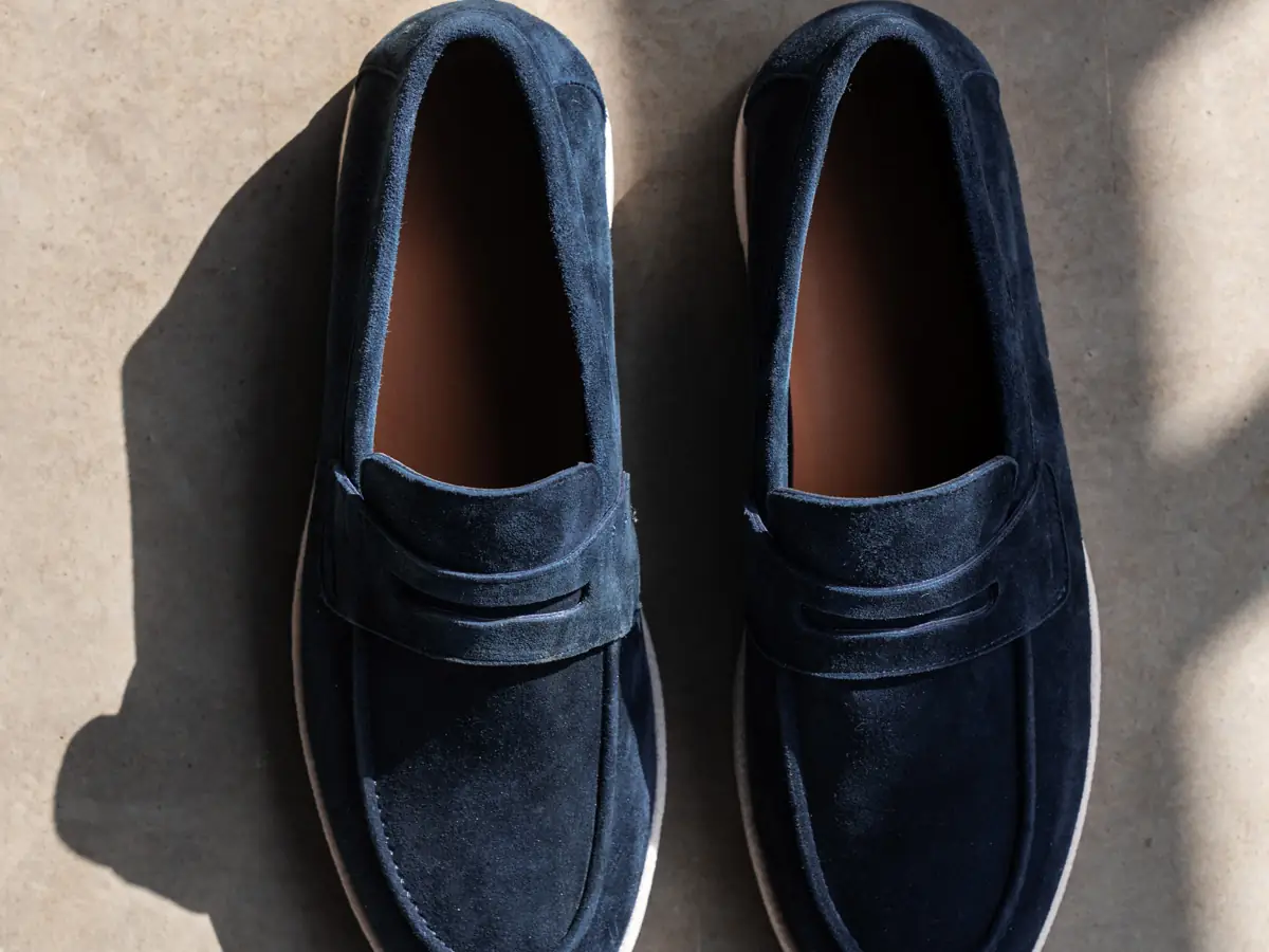 A pair of Babylon Flex-13 navy nubuck penny loafers, top view